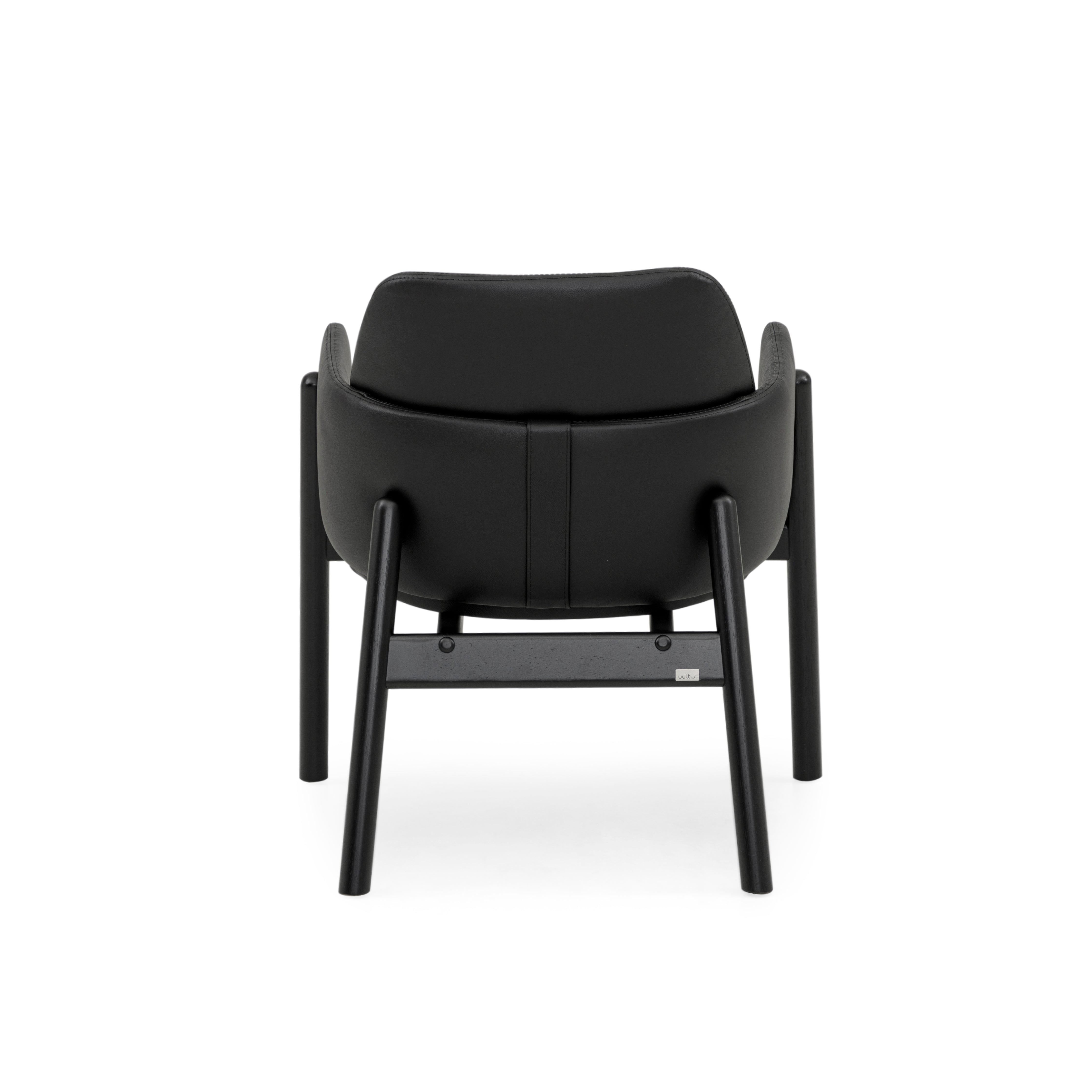 ABOVE Armchair in Black finish and Black leather