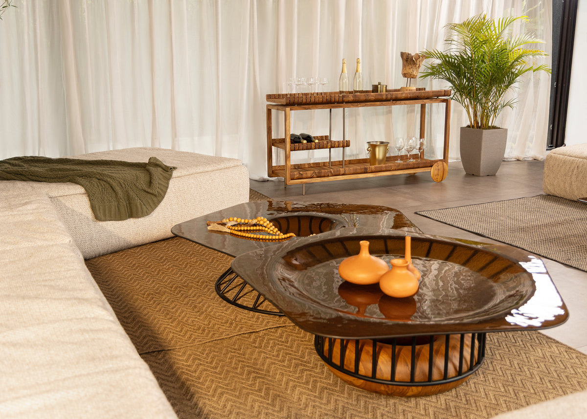 Modern living room with a stylish coffee table and decorative items.