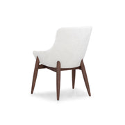 White chair with wooden legs on a white background