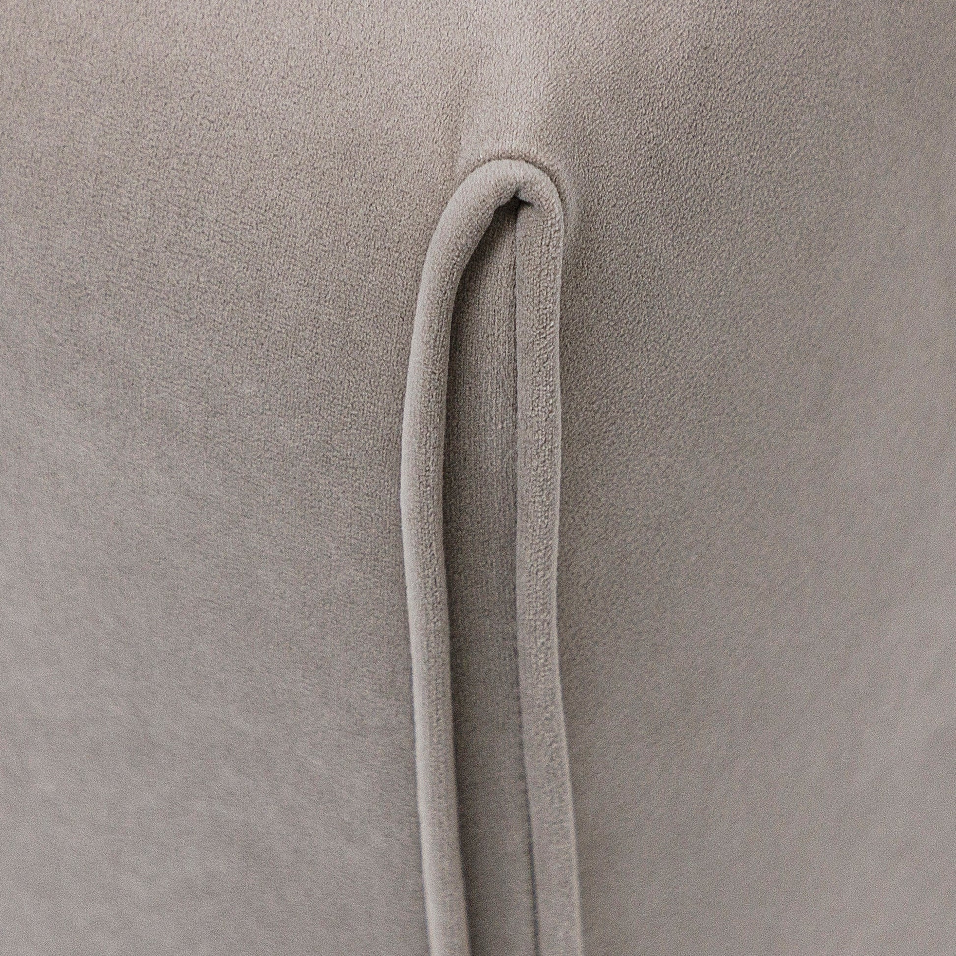 Close-up of a textured beige fabric with a handle detail