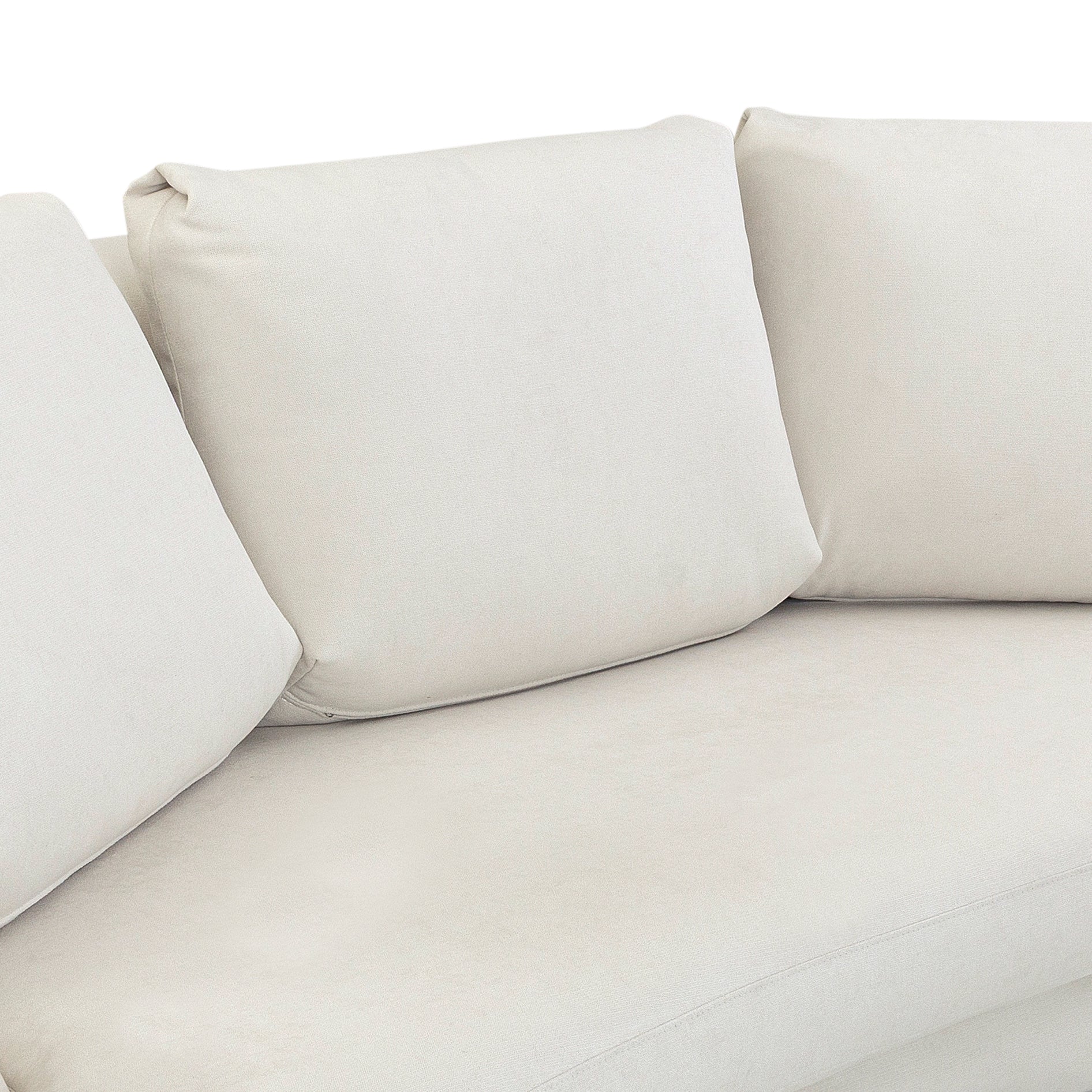 Close-up of a beige sofa with cushions on a white background