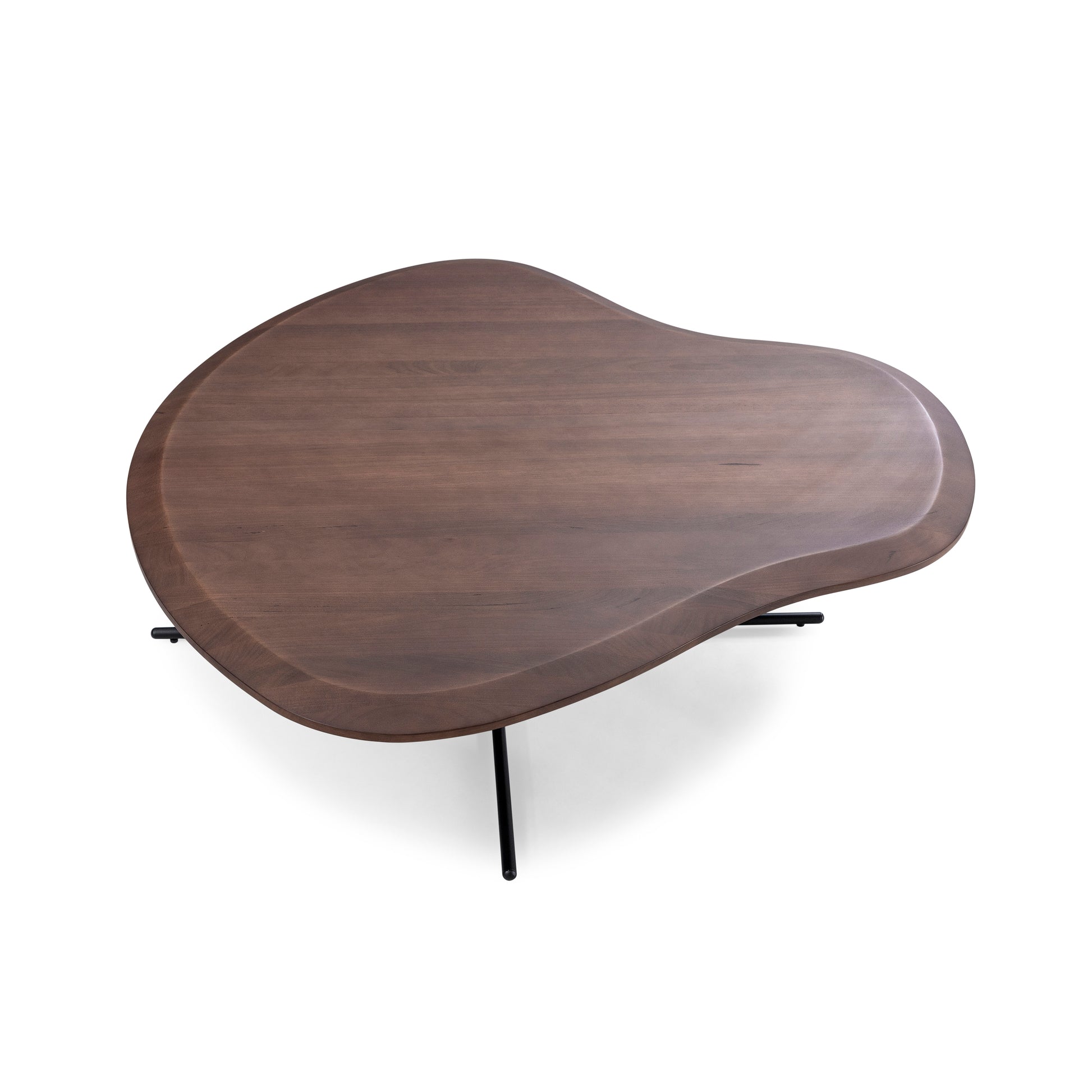 A kidney-shaped walnut wood coffee table with a black metal frame.