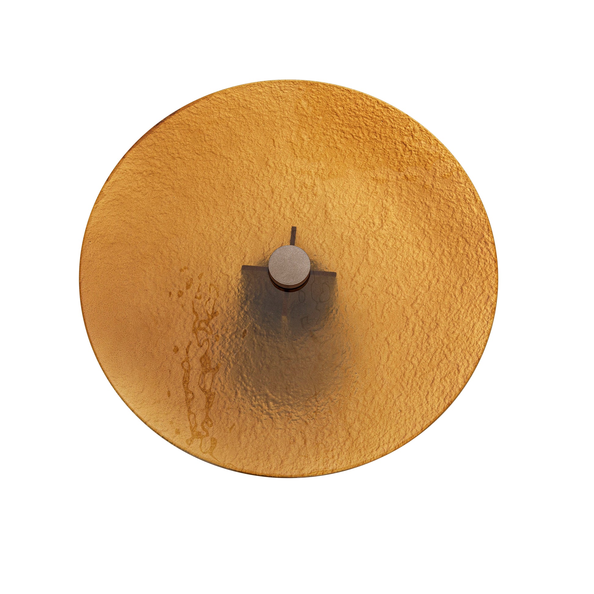 Round textured gold object on a white background