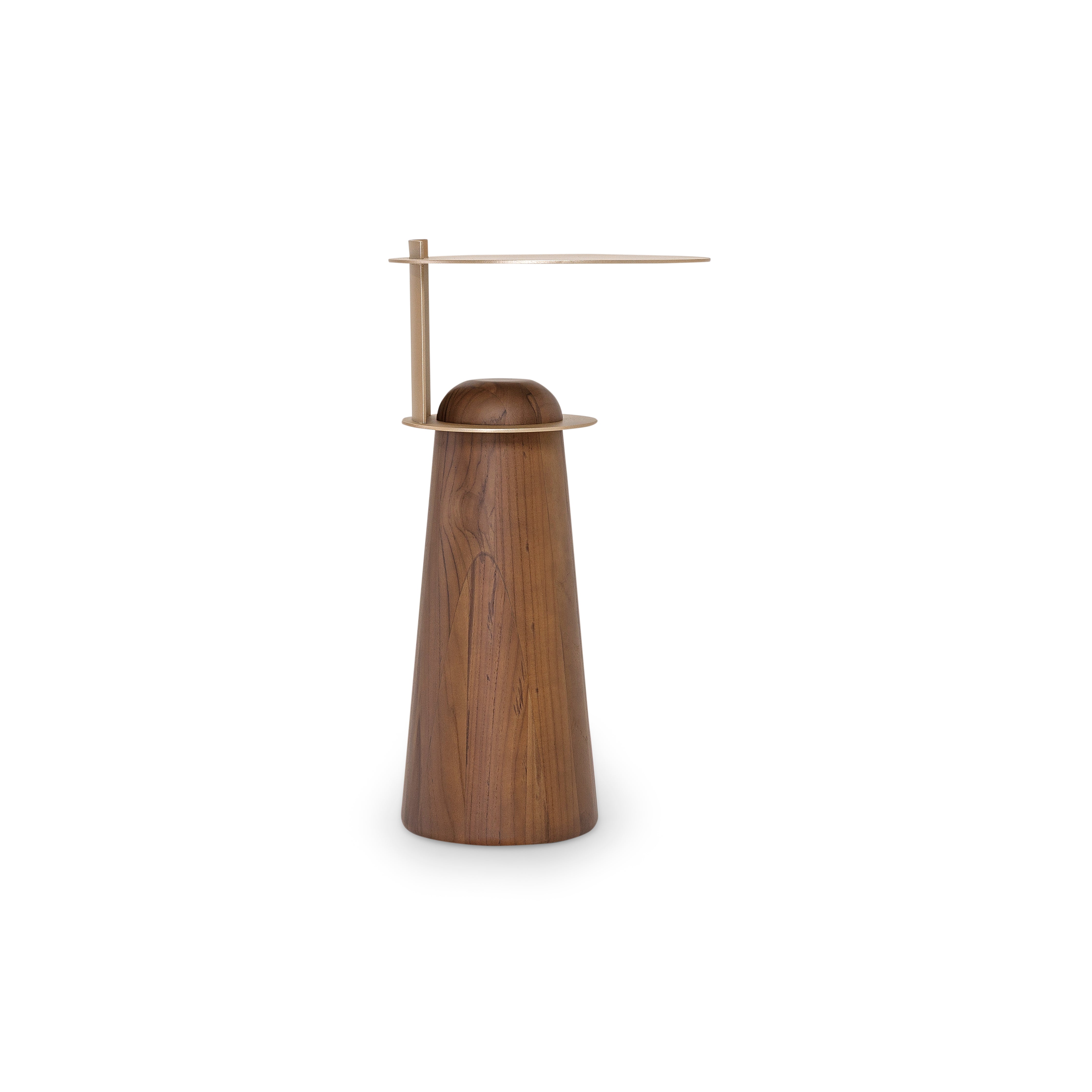 Wooden sculpture with brass accents on a white background