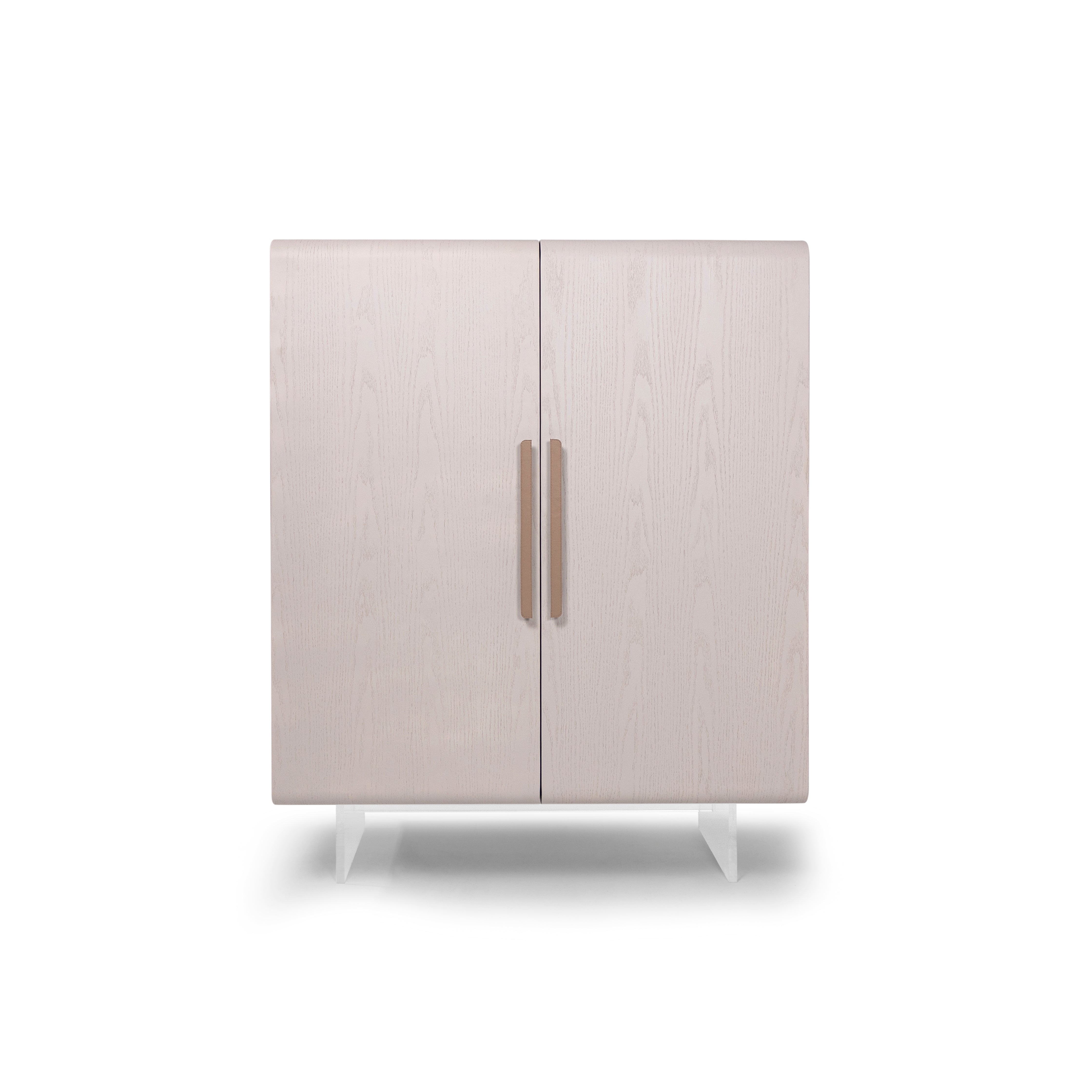 Light gray cabinet with two doors and bronze handles on a white background