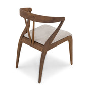 Wooden chair with a white cushion on a white background