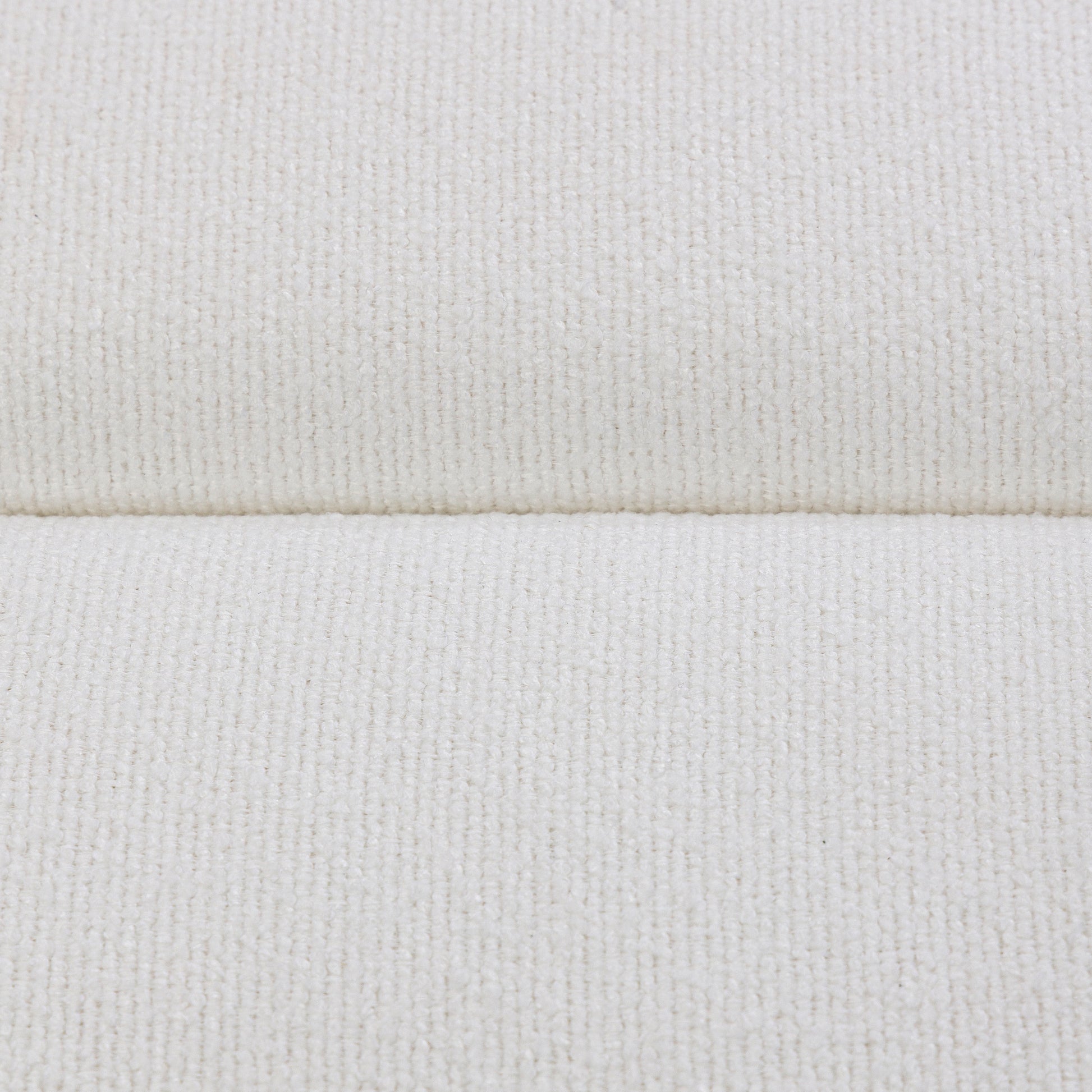 Close-up of a textured white fabric surface