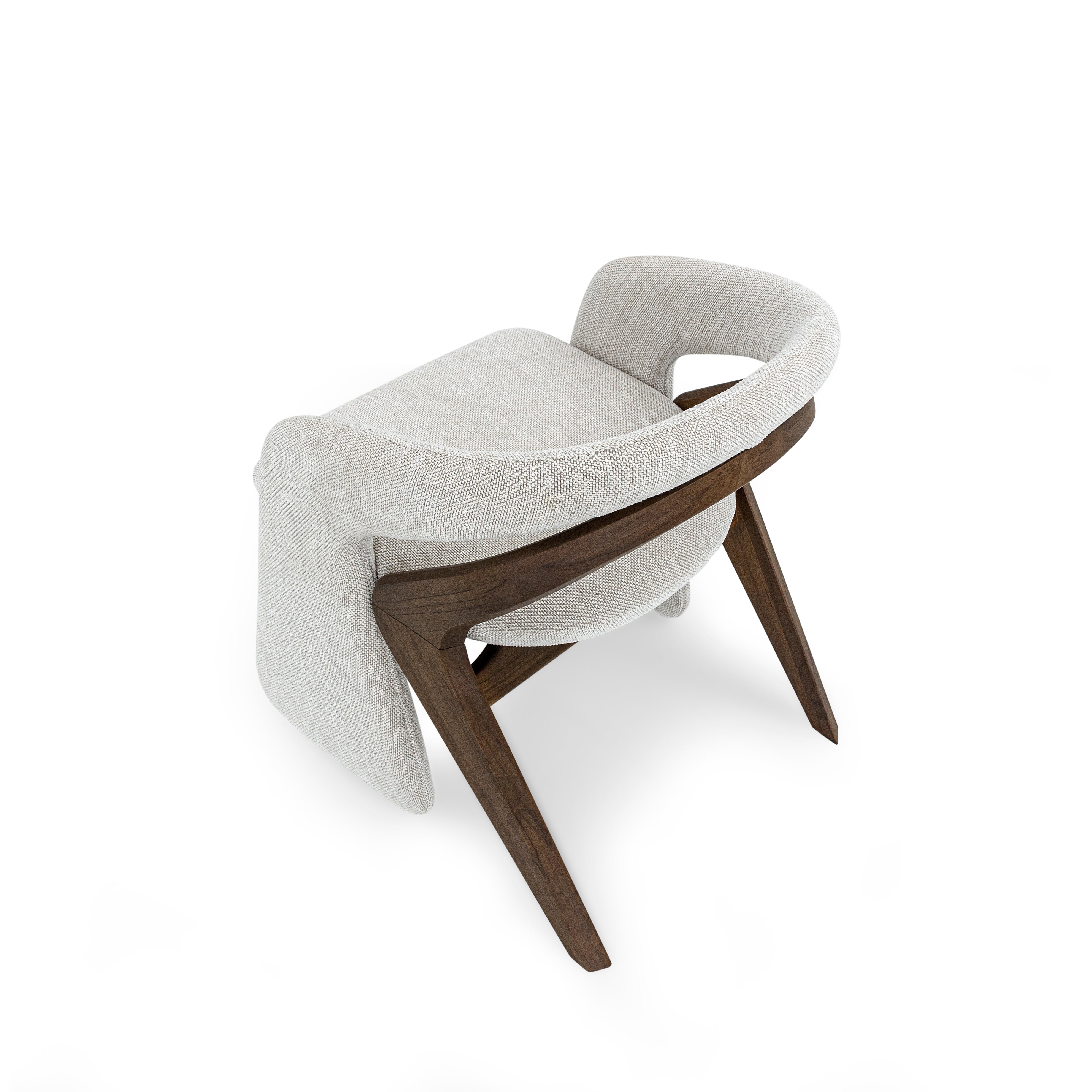 Modern chair with wooden legs and gray cushion on a white background