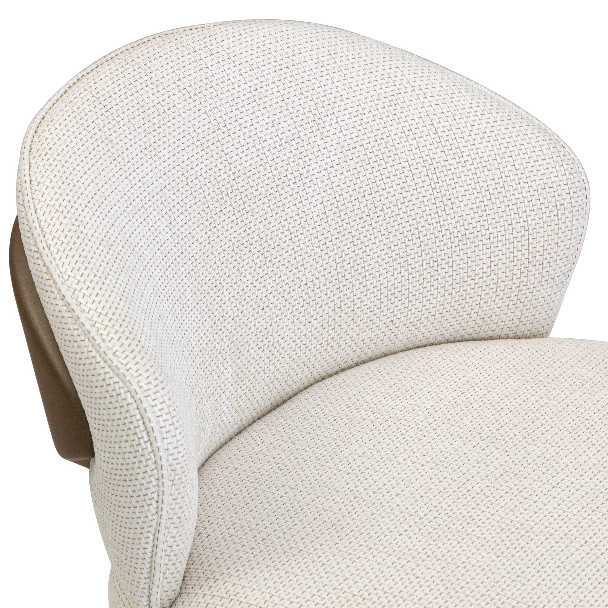 Close-up of a beige upholstered chair with a textured pattern on a white background