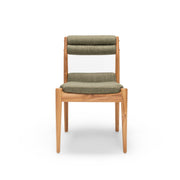 Wooden chair with green cushion on a white background