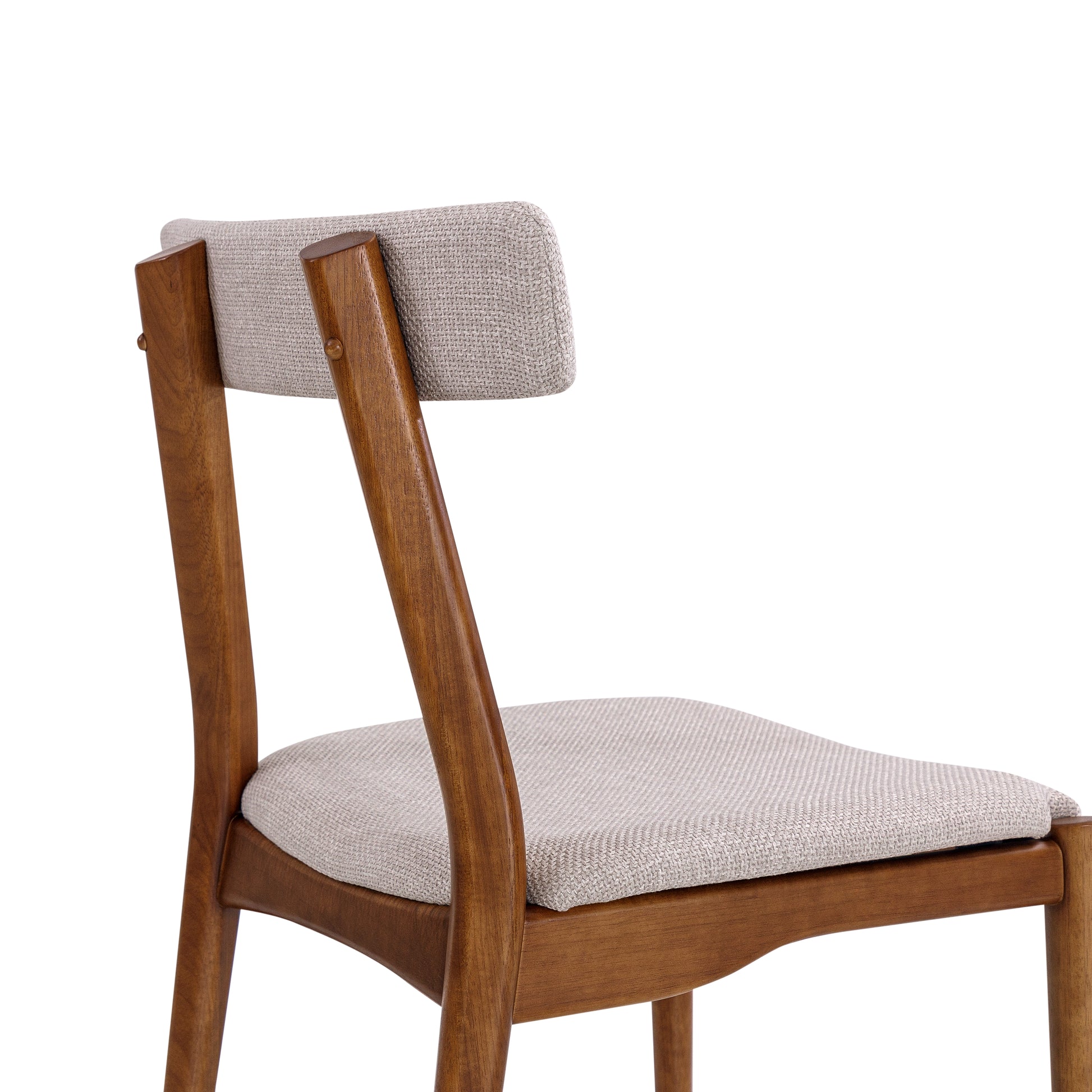 Wooden chair with gray cushioned seat and backrest on a white background