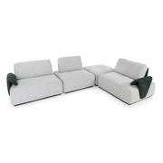 Modern sectional sofa with green accents on a white background