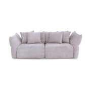 Gray sofa with multiple cushions on a white background