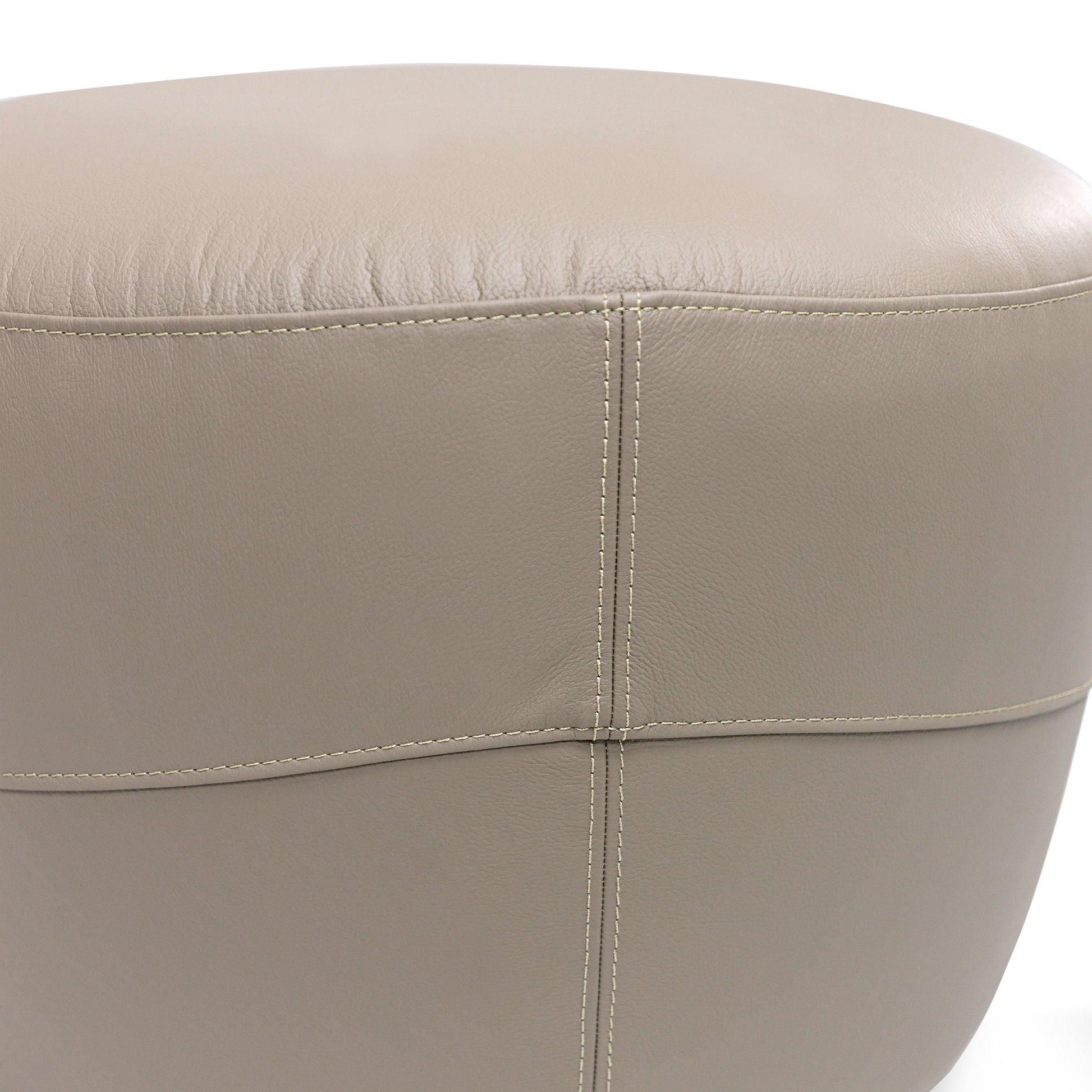 Close-up of a beige leather ottoman on a white background