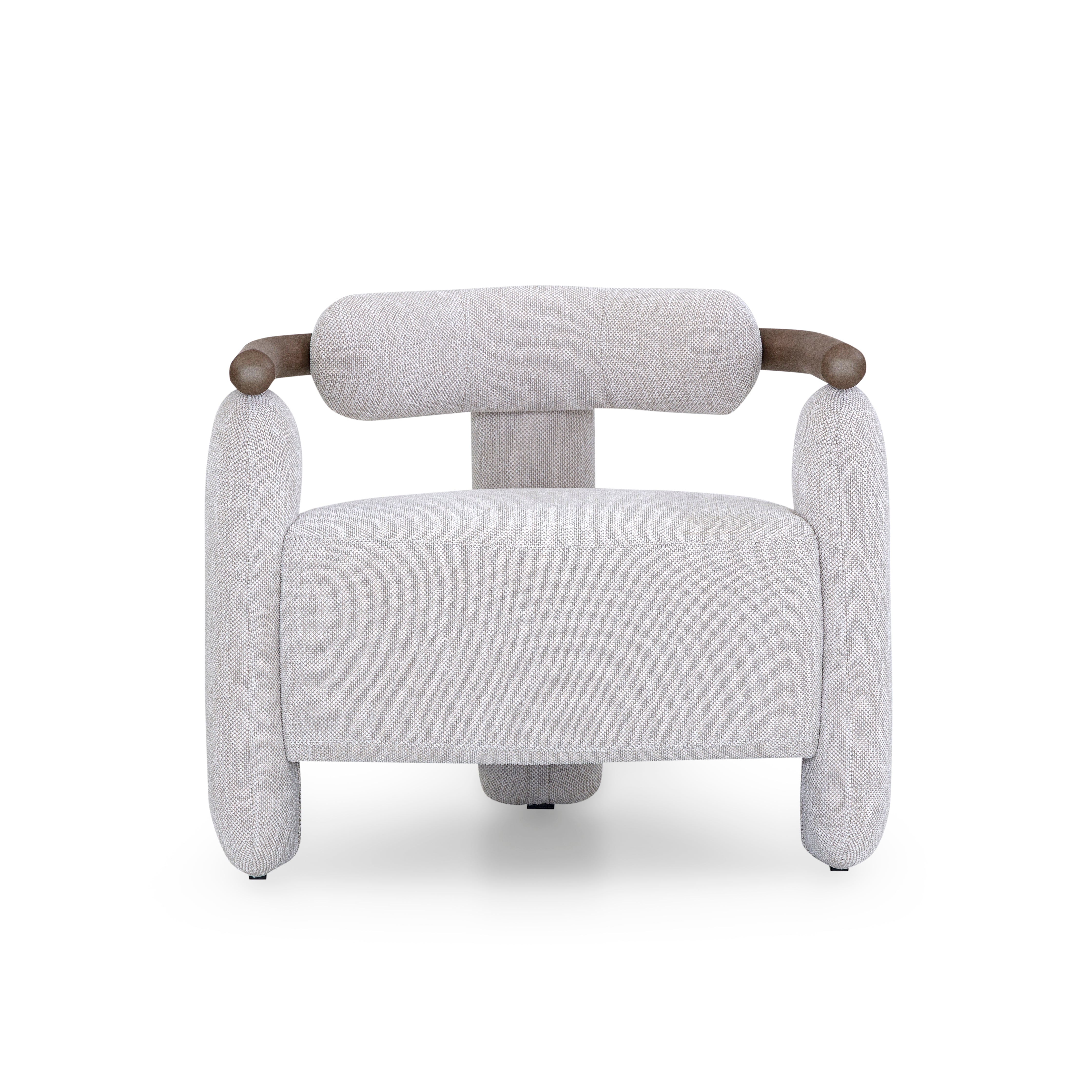Modern armchair with gray upholstery and brown armrests on a white background