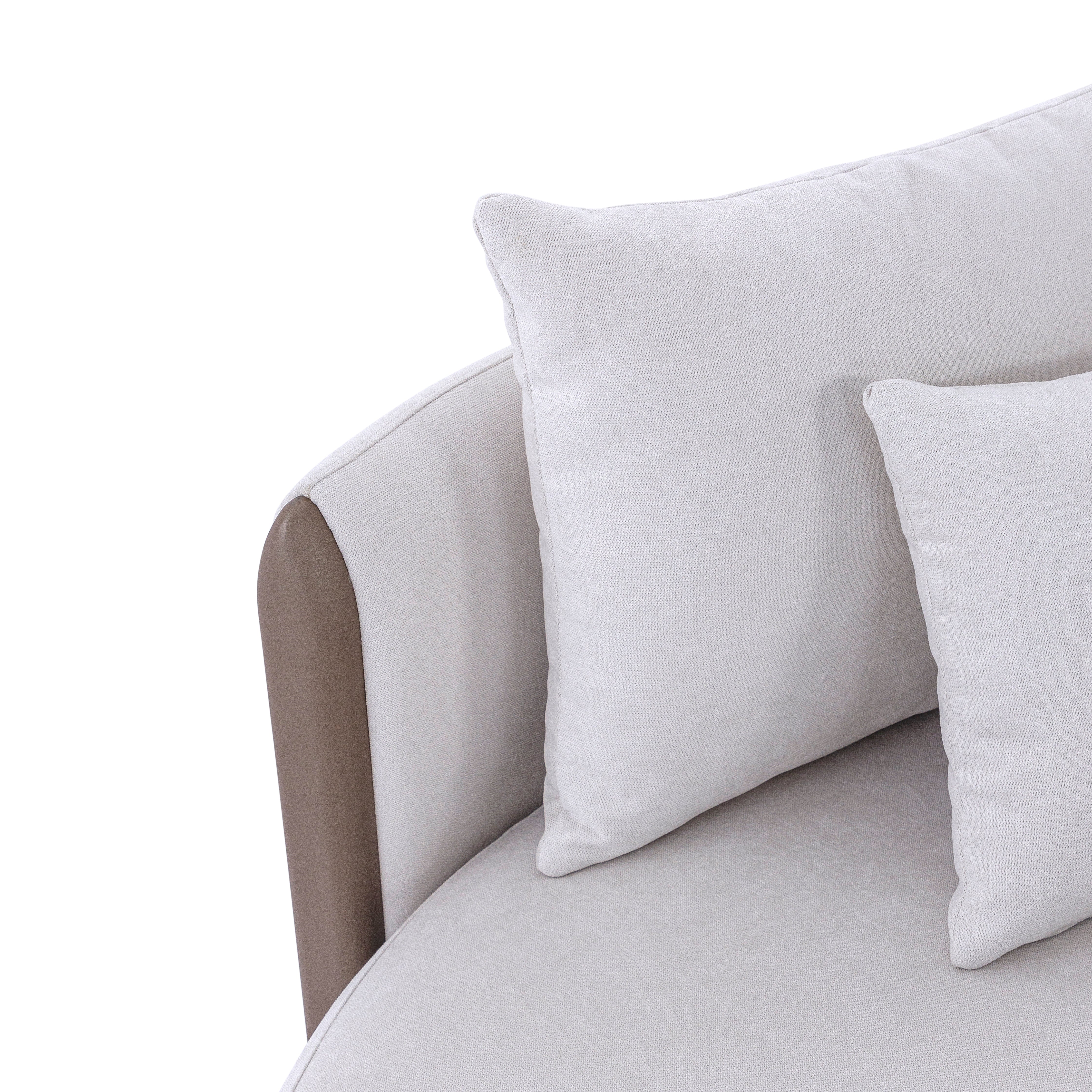 Gray sofa with white cushions on a white background