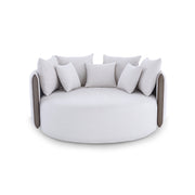 Modern round sofa with cushioned backrest on a white background