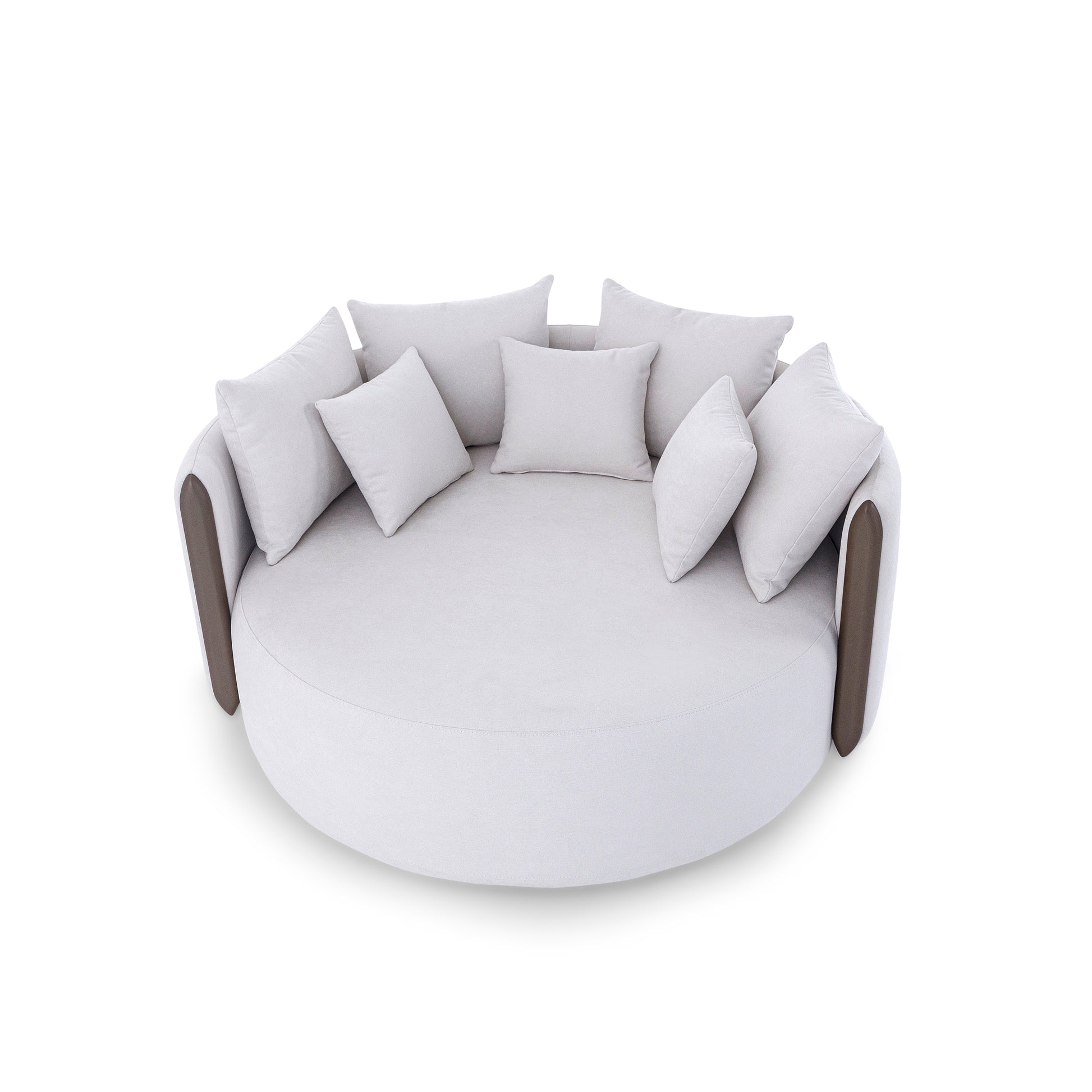 Round white sofa with multiple cushions on a white background