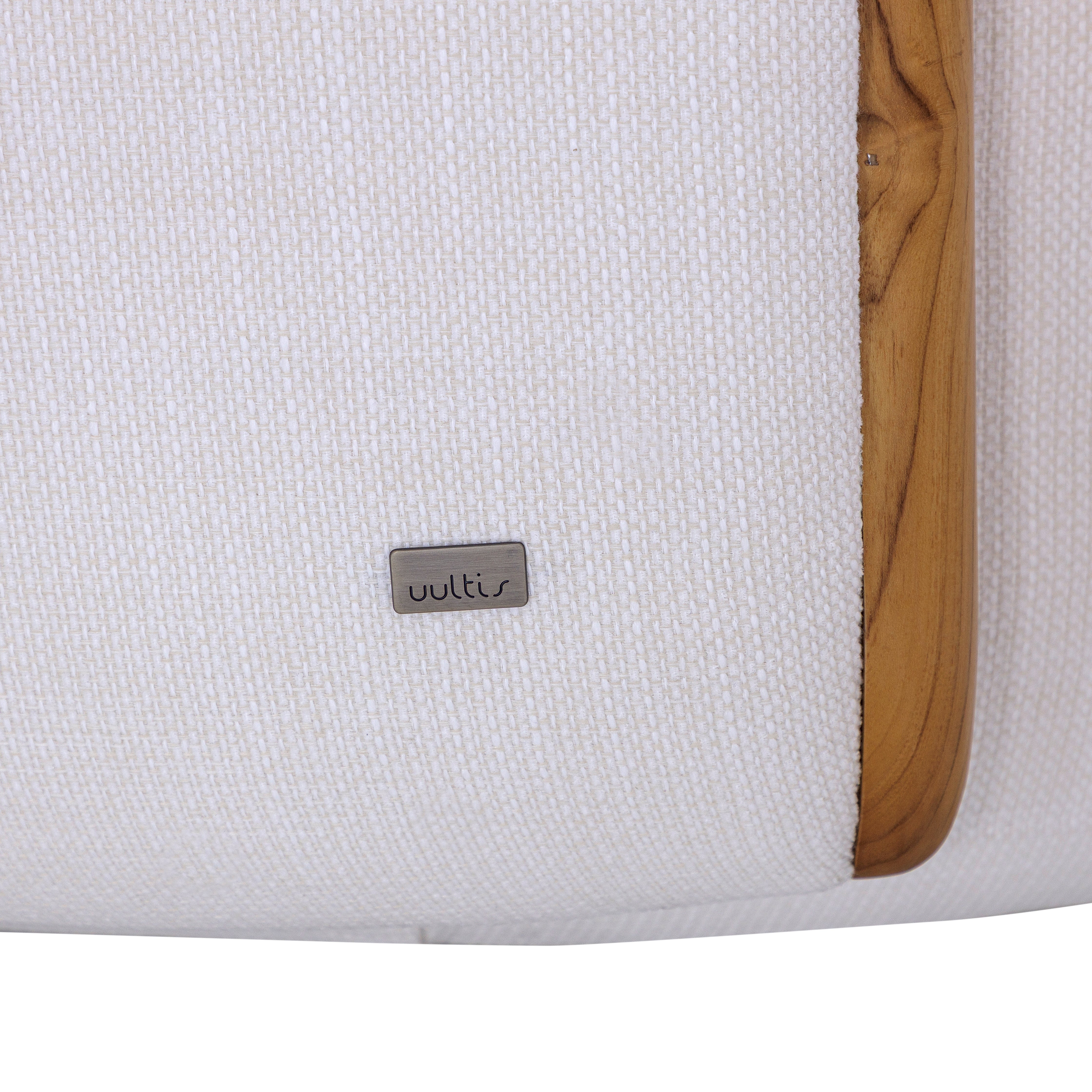White cushion with a wooden border and 'woltus' brand label on a white background