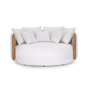 White circular sofa with wooden edges and white cushions on a white background