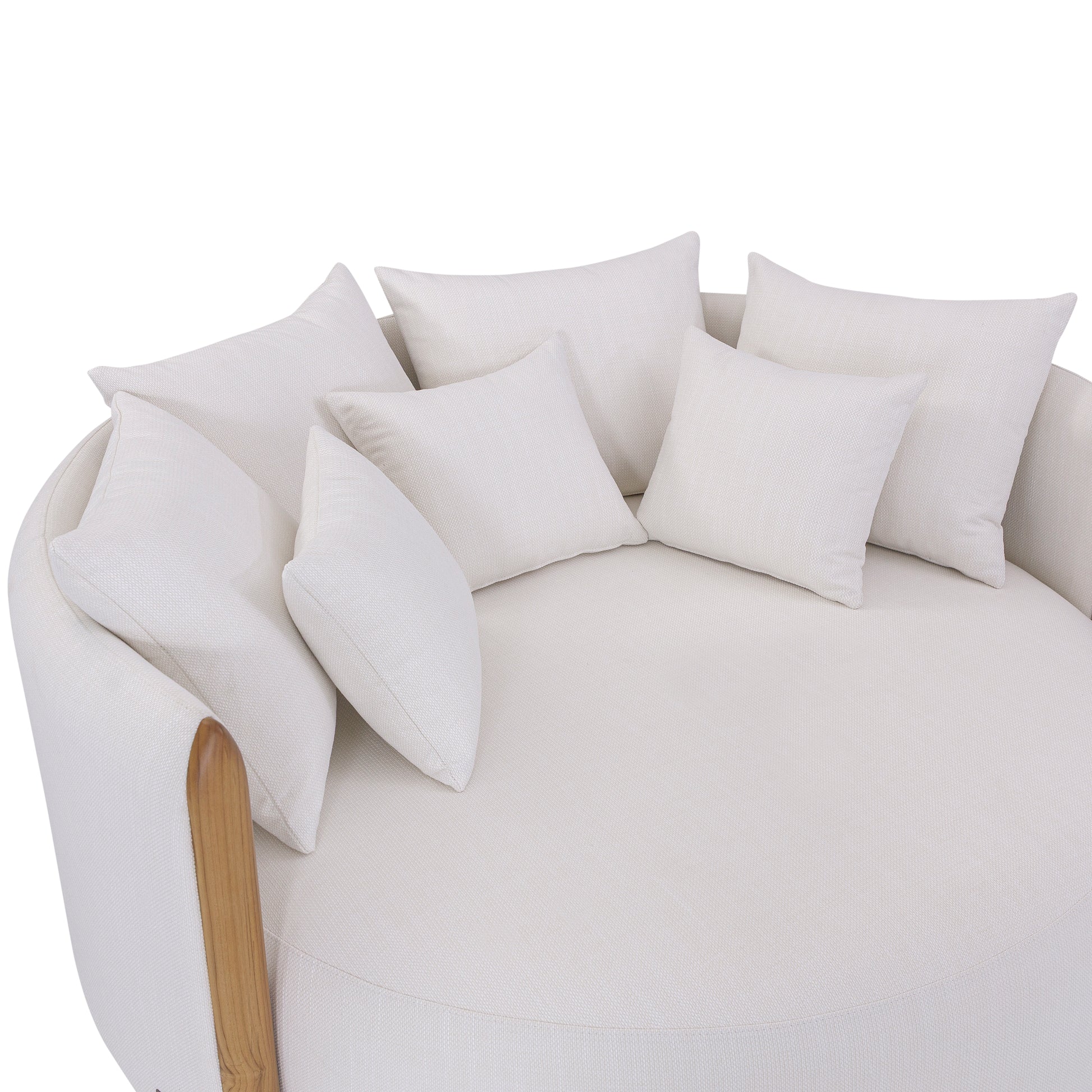 White pillows on a light gray sofa with wooden armrests against a white background