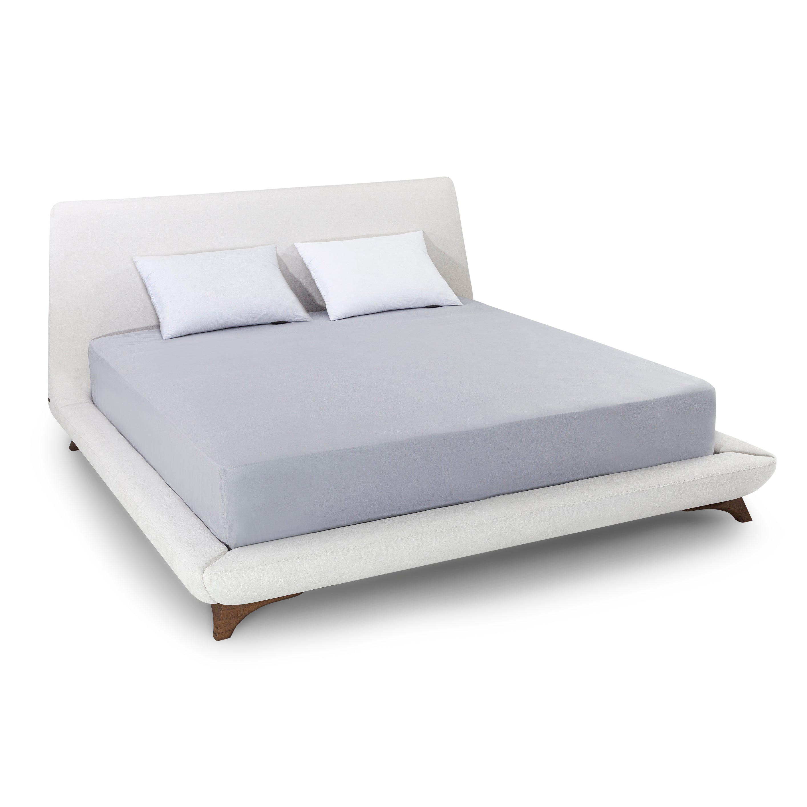 White bed with gray mattress cover and white pillows on a white background